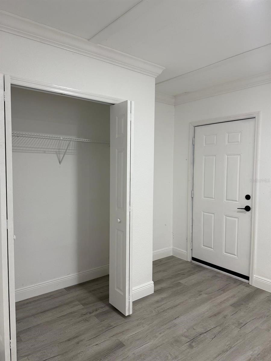 Bedroom 4 closet with door to exterior