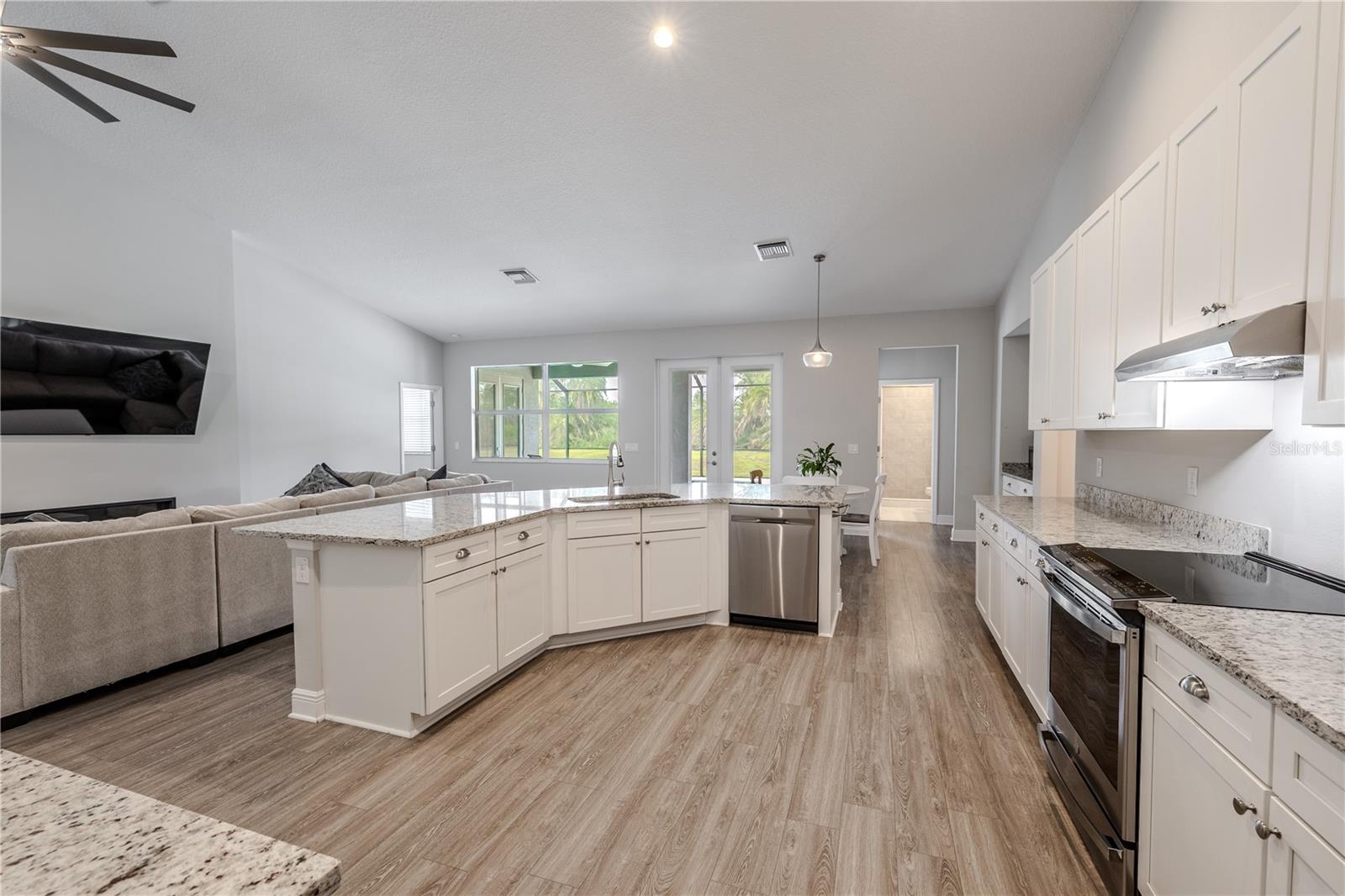 The kitchen’s open-concept design shines, seamlessly connecting to the family room and dining area.