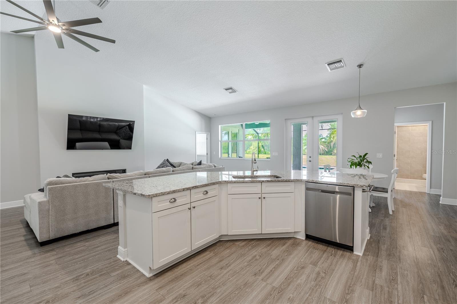 he kitchen’s open-concept design shines, seamlessly connecting to the family room and dining area.