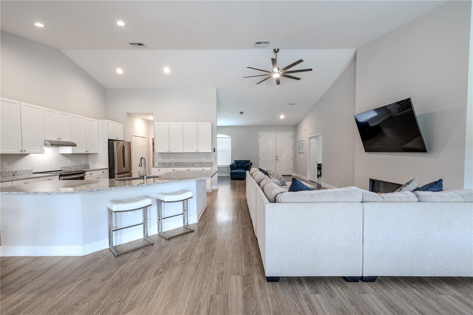 This central hub is designed for both comfort and entertaining, with effortless flow between cooking, dining, and relaxing.