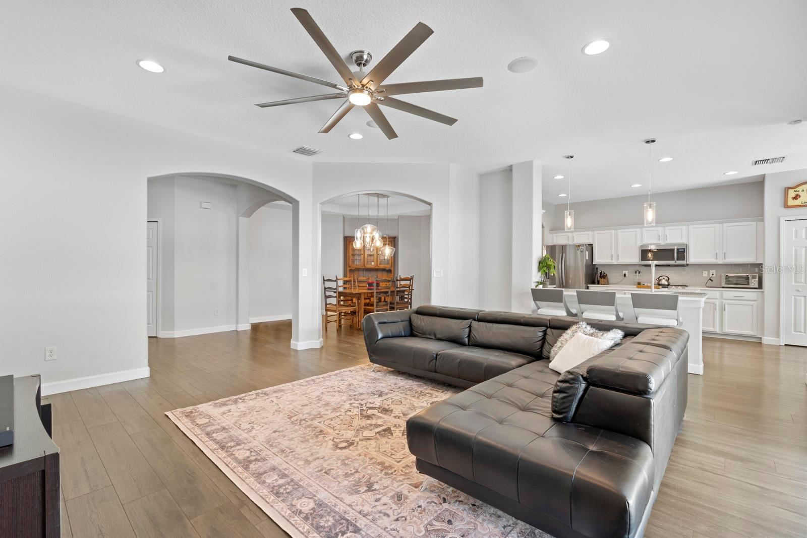 Living room with kitchen/dining room view