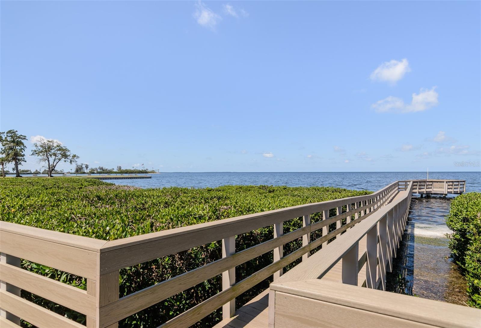 Waterfront boardwalk to two viewing docks for enjoying vibrant sunsets!