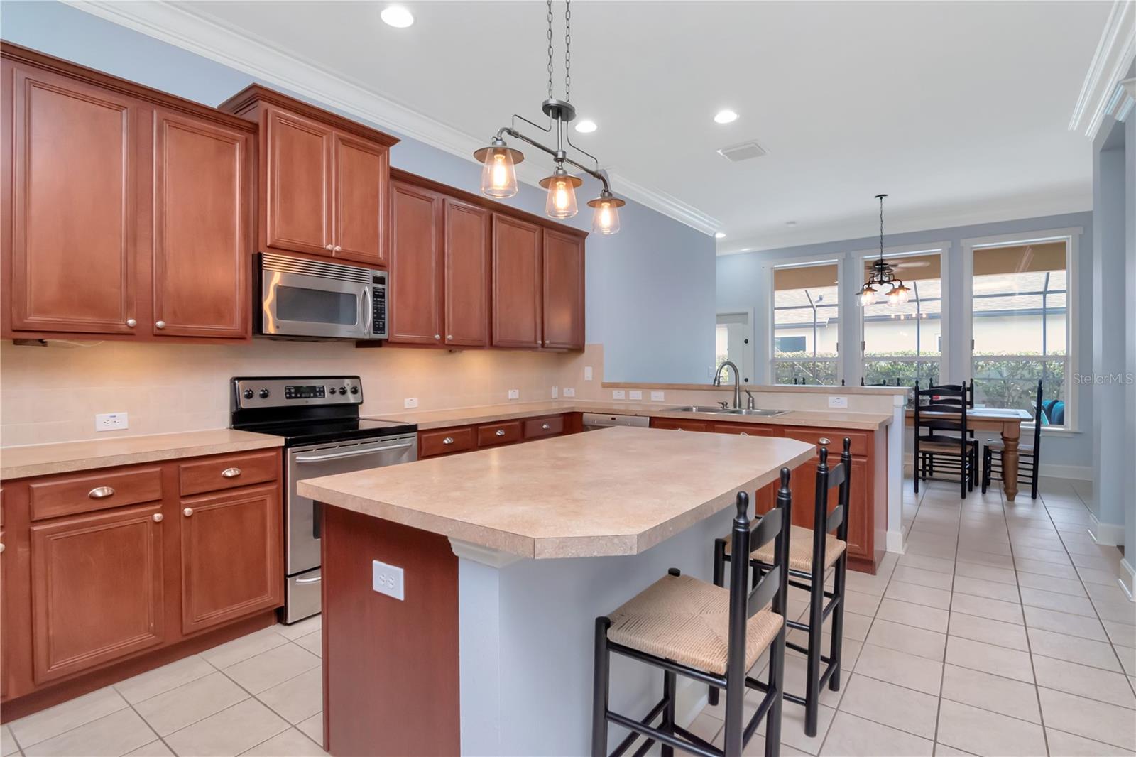 Kitchen with Under Cabinet Lighting, Island, Breakfast Bar, Stainless Steel Appliances, Counter/Storage Space