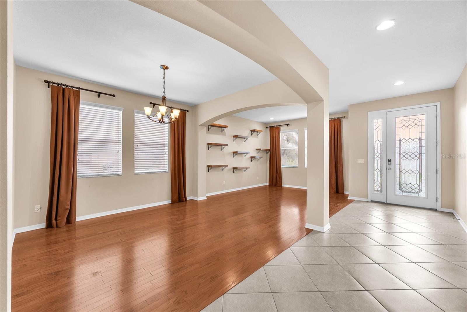 The front leaded glass door with side light allows light to pour into this home.
