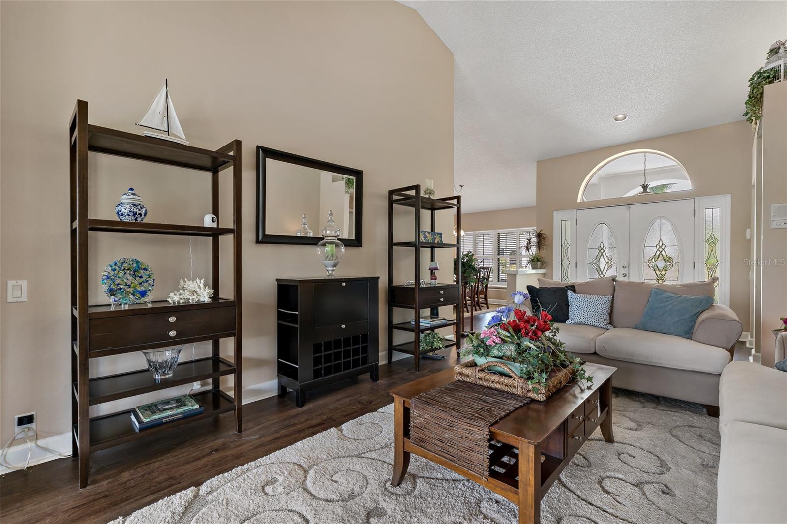 FORMAL LIVING ROOM WITH VAULTED CEILINGS