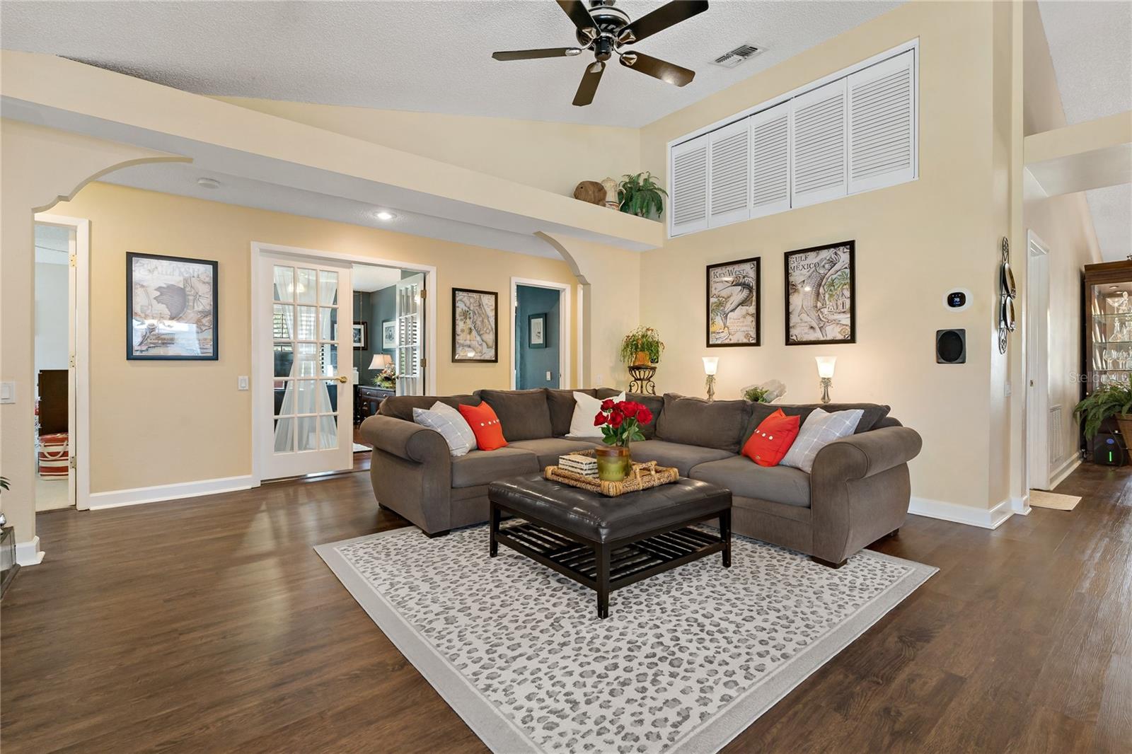 VAULTED CEILINGS, WITH EXTRA STORAGE ON BACK WALL ALONG WITH DECORATIVE SHELVING