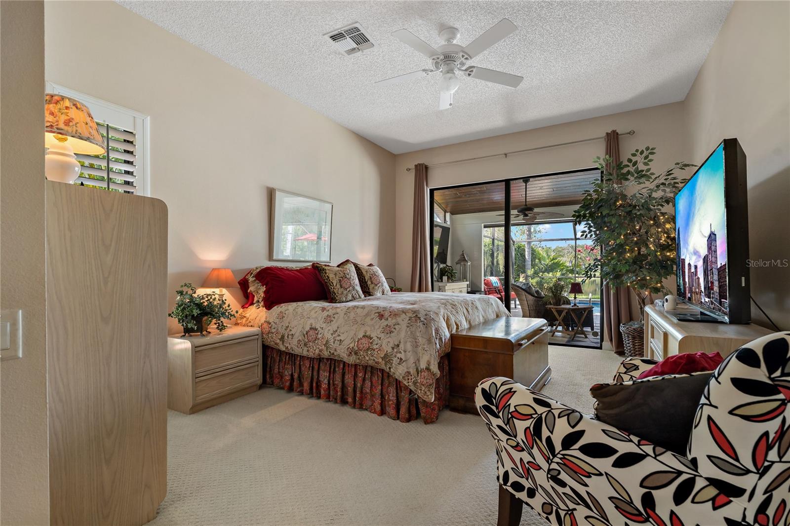 PRIMARY SUITE WITH SLIDING DOORS TO THE BACKYARD RETREAT!