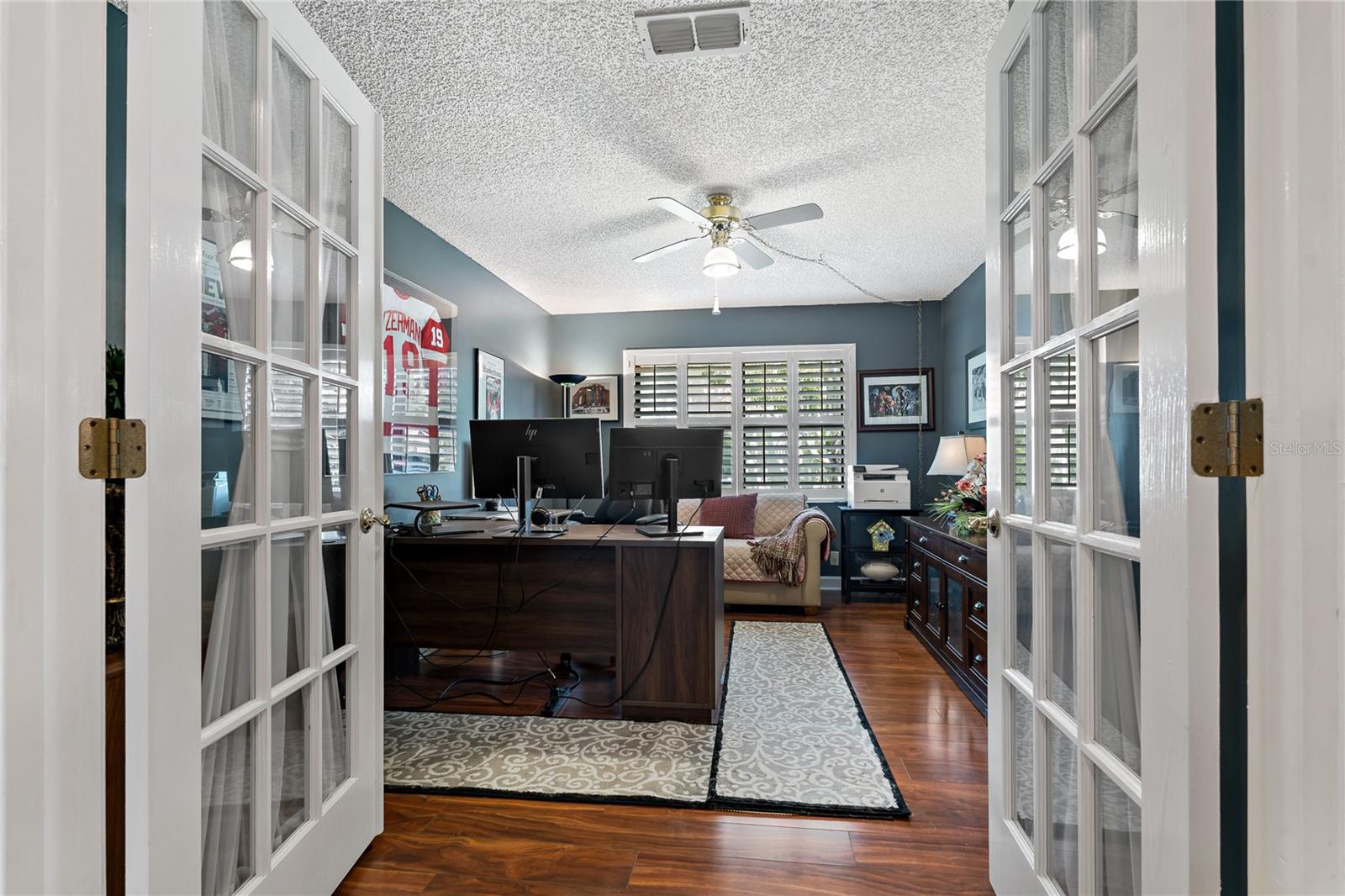 FRENCH DOORS LEADING INTO THIS GUEST BEDROOM, CURRENTLY BEING USED AS AN OFFICE