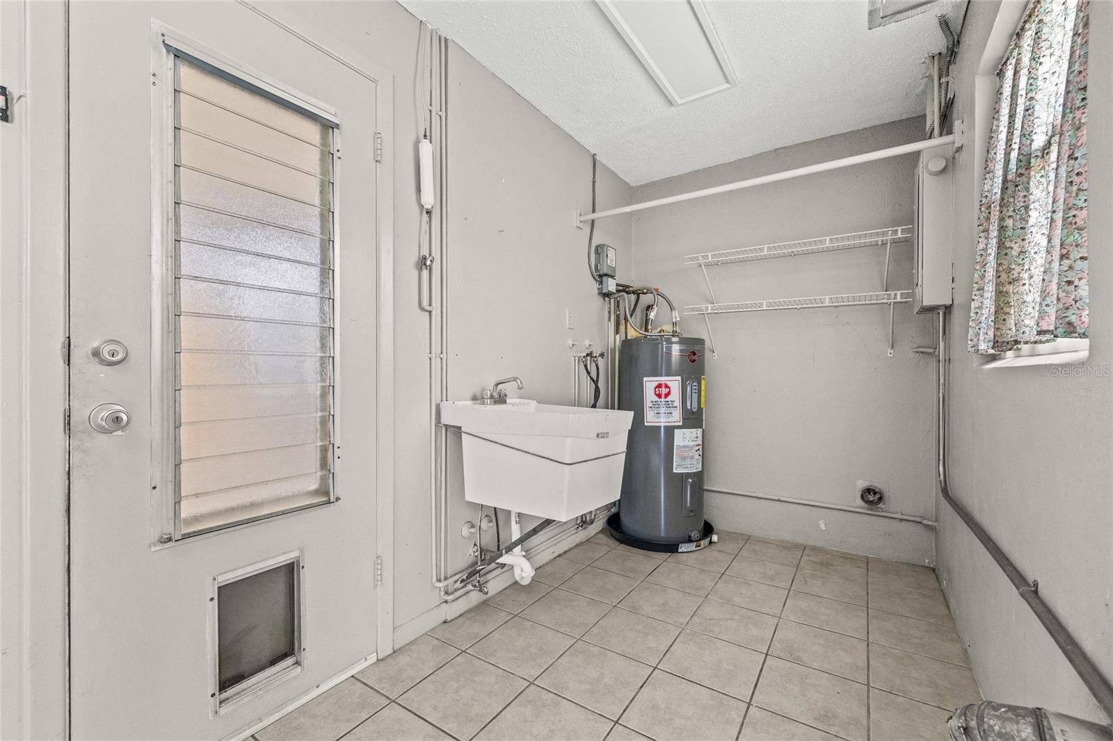 Water heater is 3 years old. Washer and Dryer hook ups located in the garage.