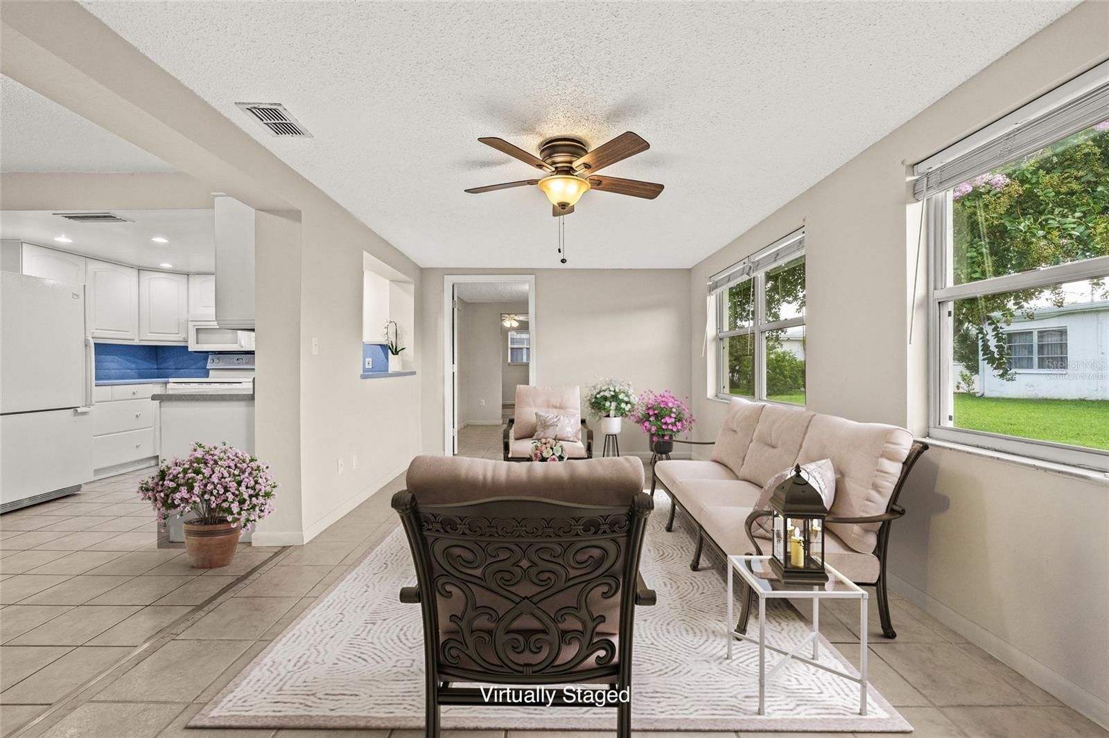 Virtually StagedFlorida room with lots of natural light.