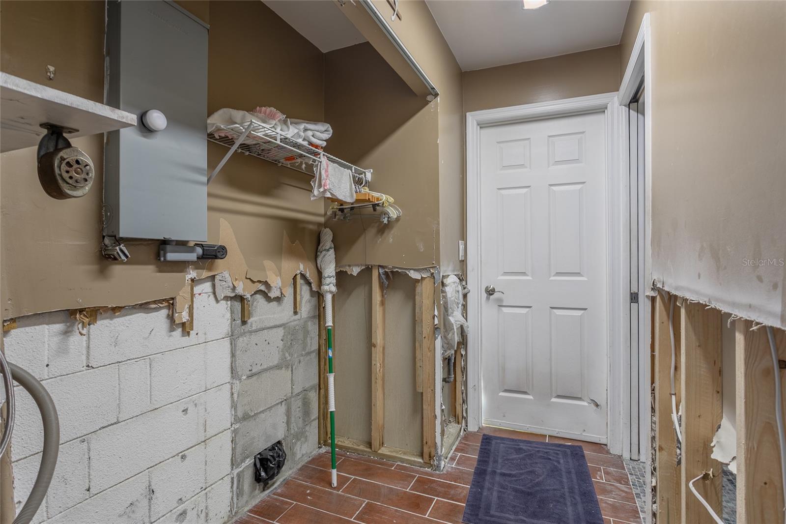 Laundry room leading to the garage