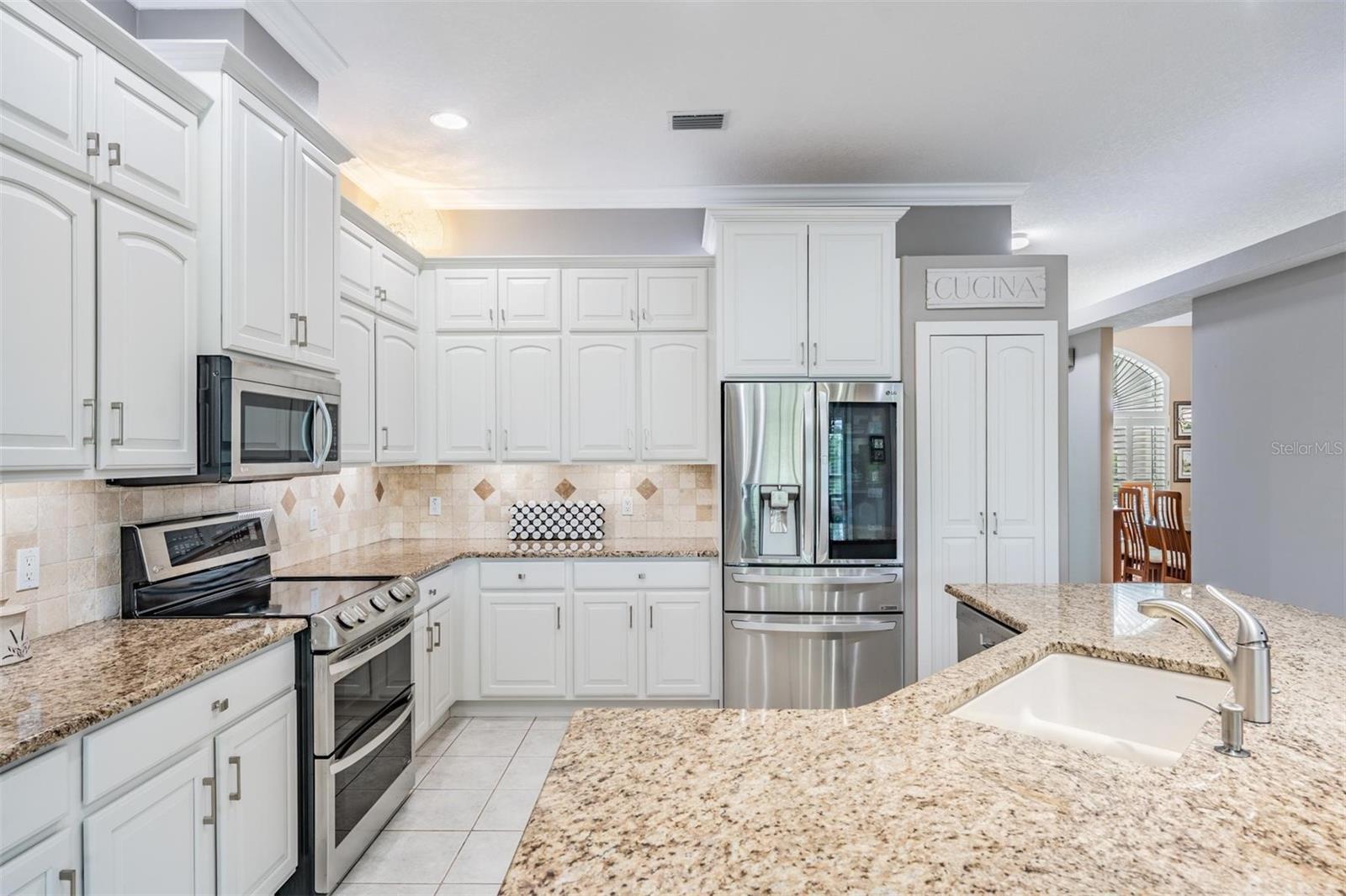Granite countertops with white cabinets and SS appliances is a great combo