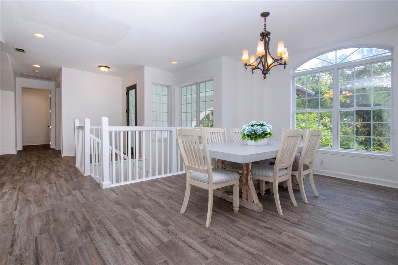 DINING ROOM WITH A VIEW OF THE FRONT YARD