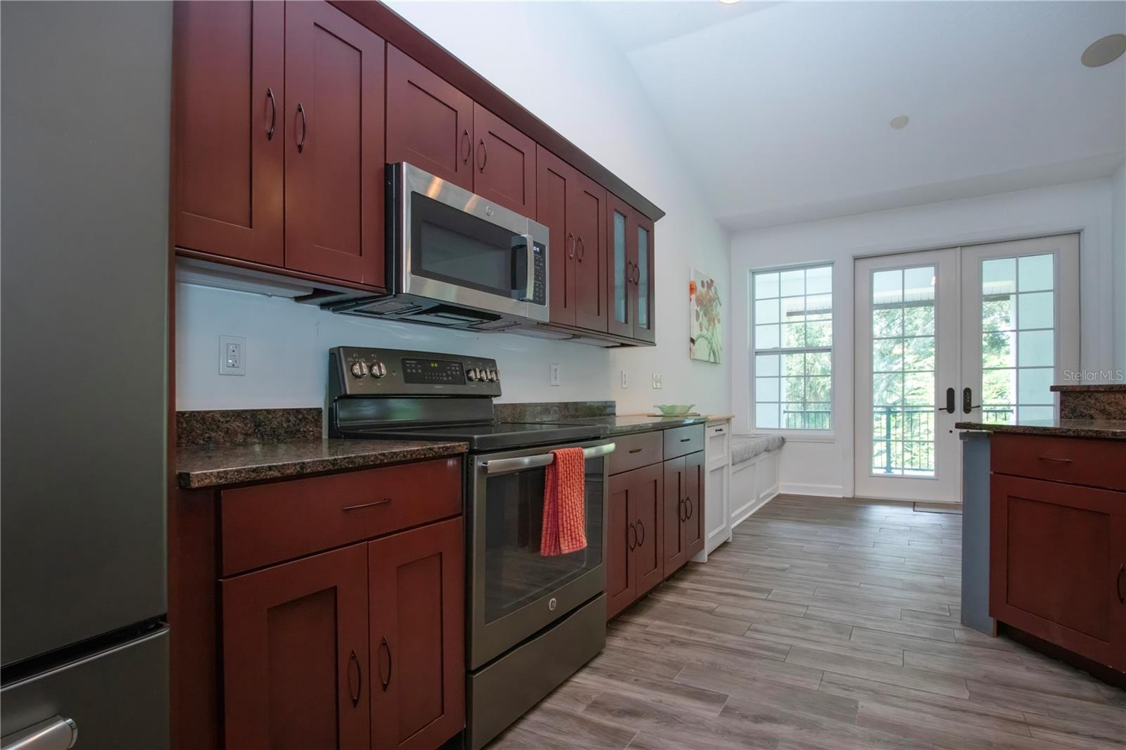 KITCHEN LEADING TO BREAKFAST NOOK AND FRENCH DOORS