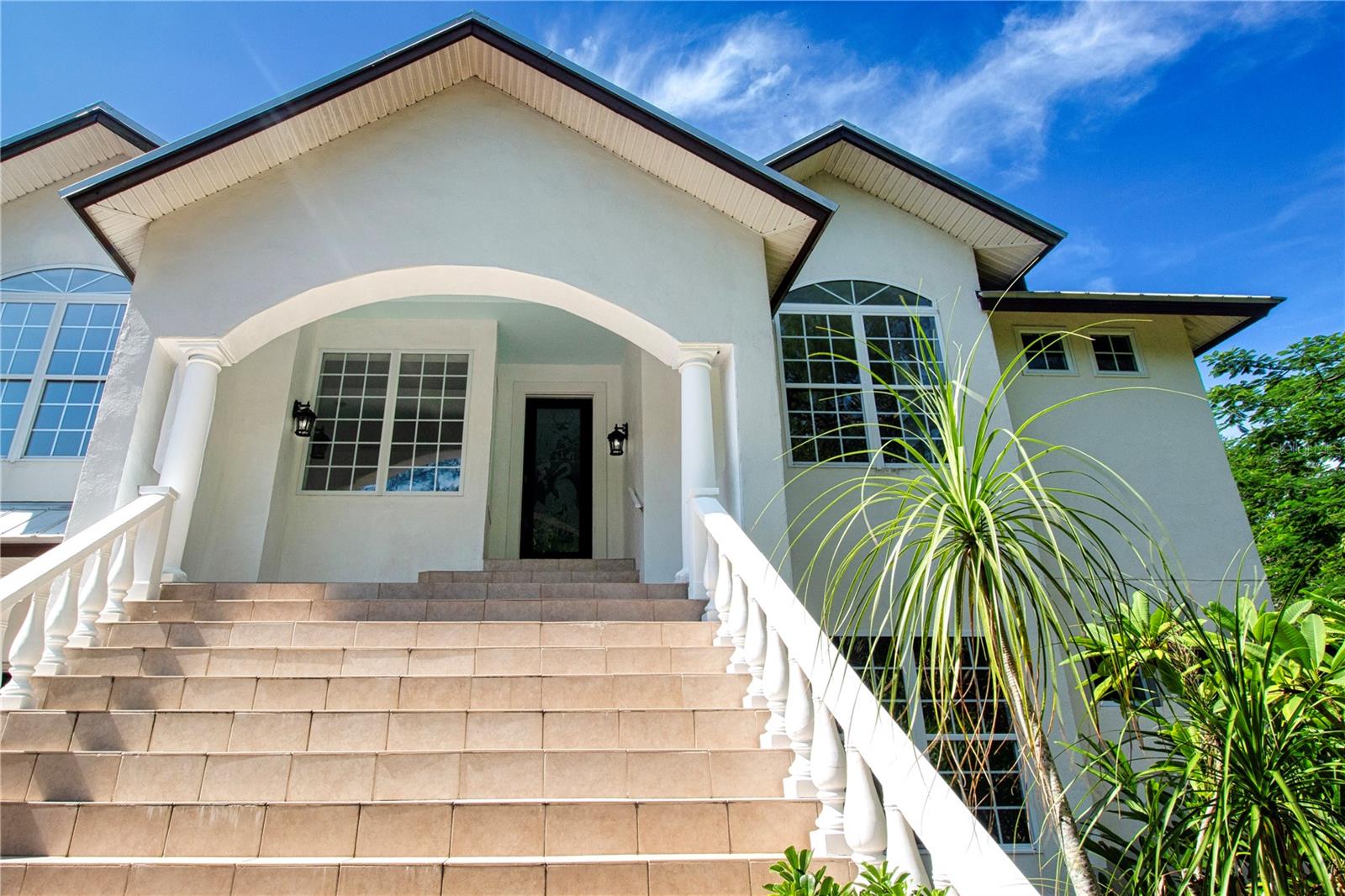 GRAND STAIRCASE AND FRONT PORCH