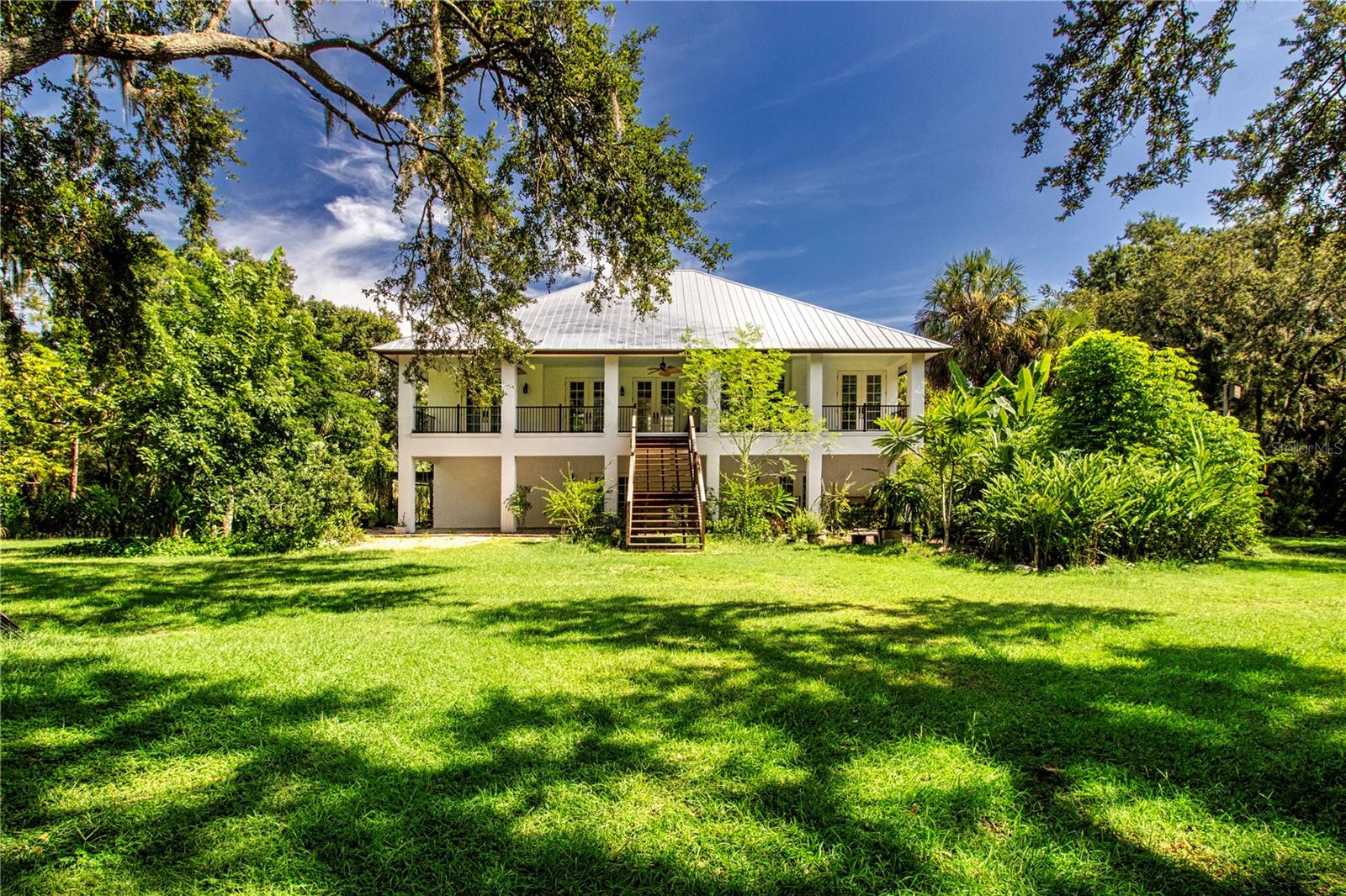 VIEW OF THE BACK OF THE HOUSE