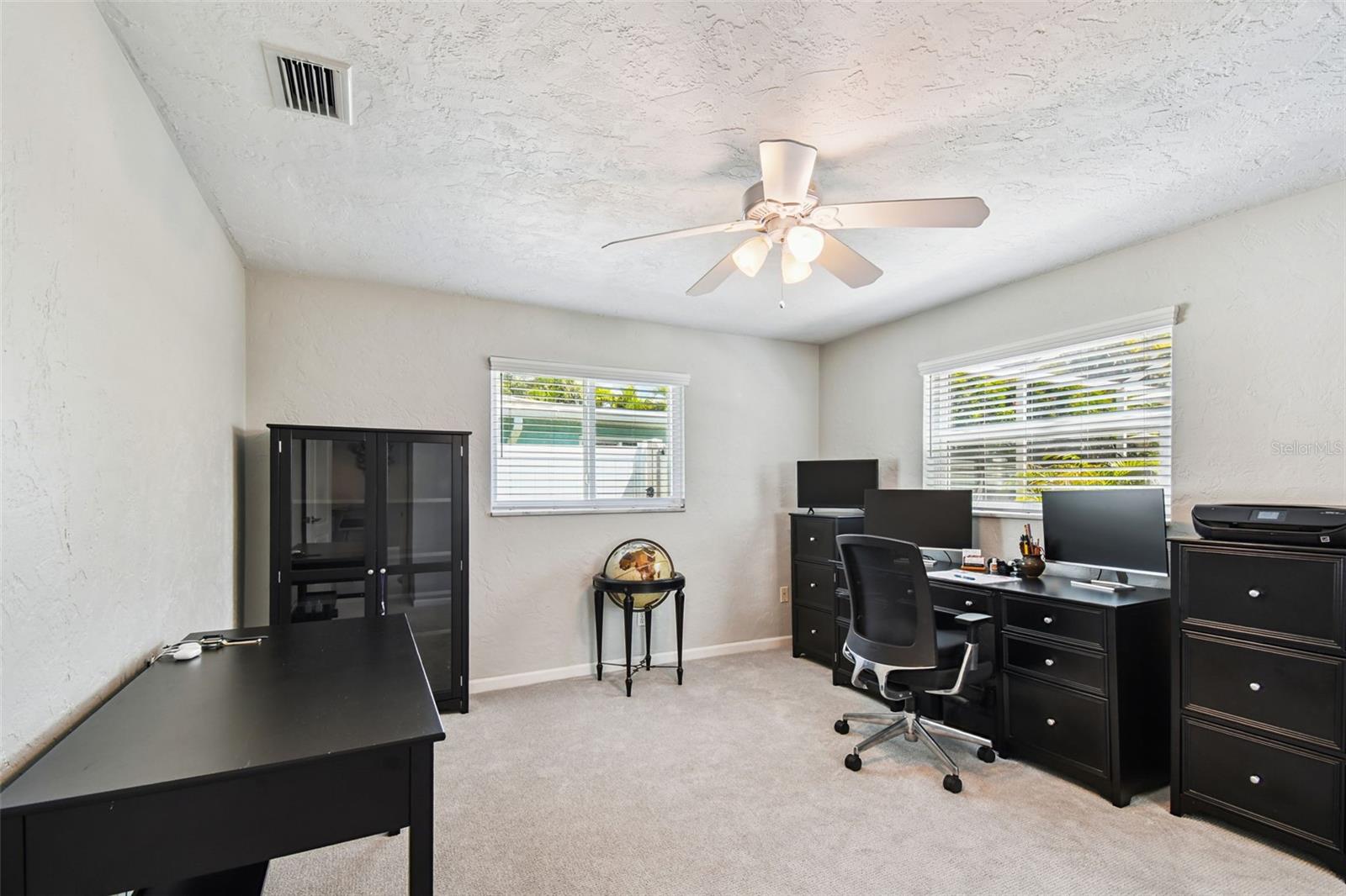 Very bright room with windows facing East and one window facing North