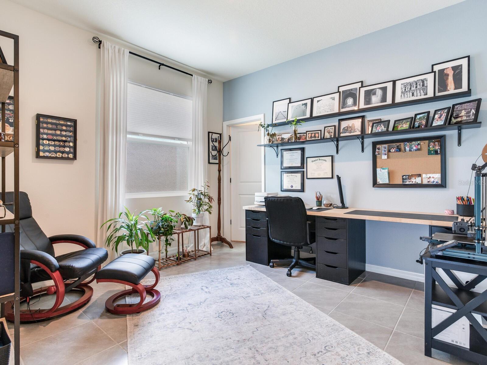 3rd bedroom/office with tile flooring and walk in closet