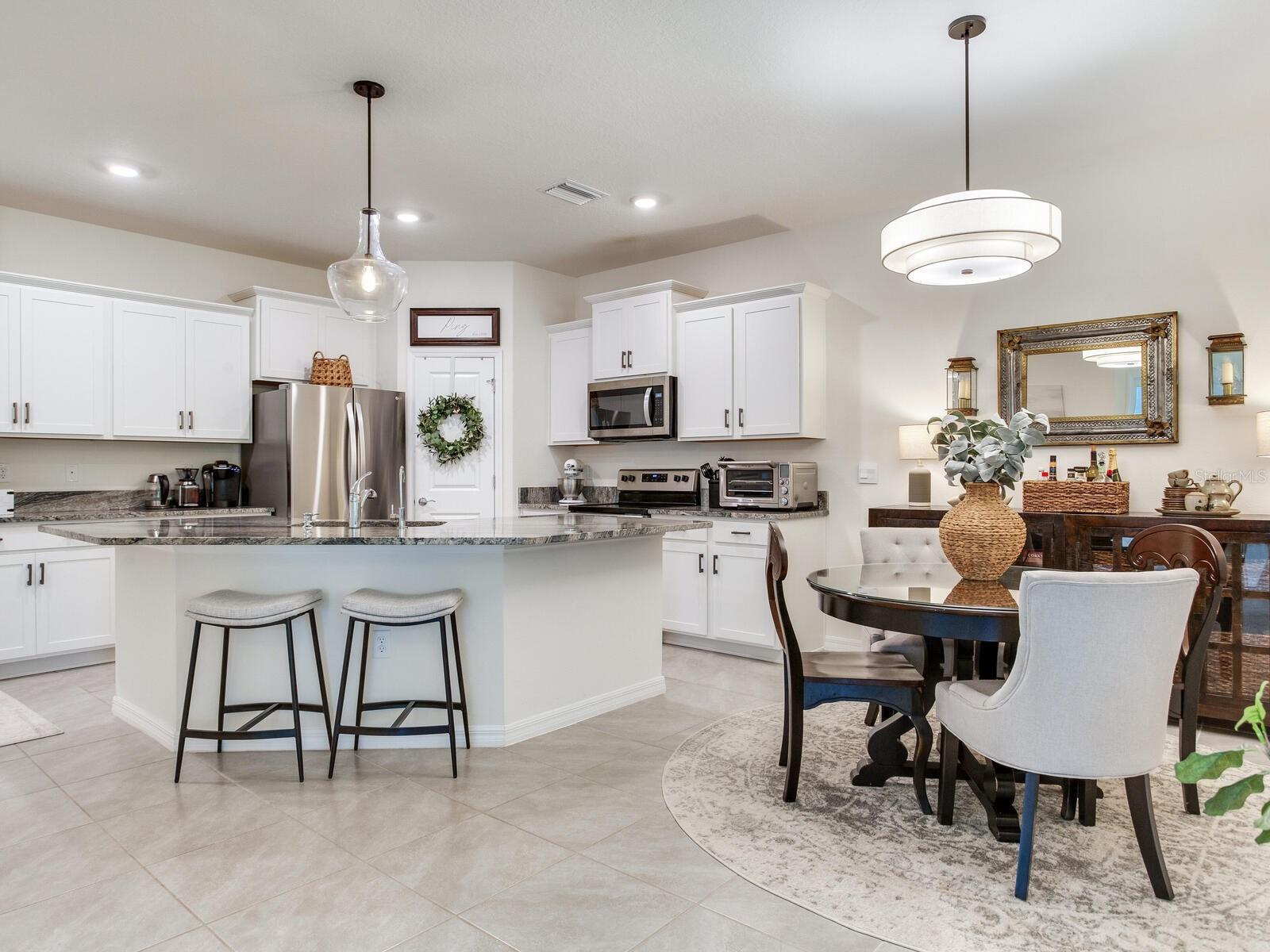 Large kitchen with granite, walk in pantry and stainless steel appliances