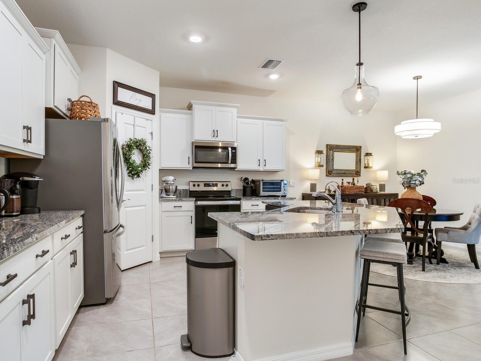 Kitchen and dining room with upgraded lighting