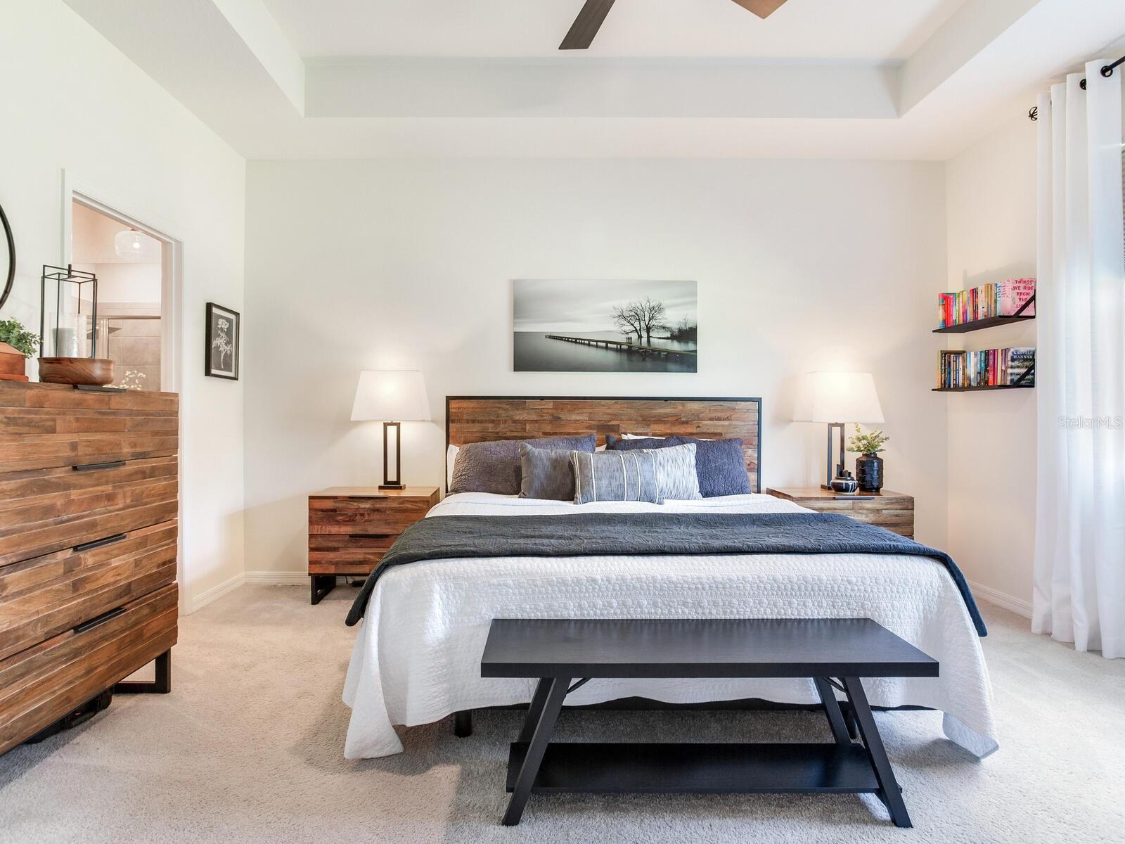 Mater suite with coffered ceiling and walk in closet