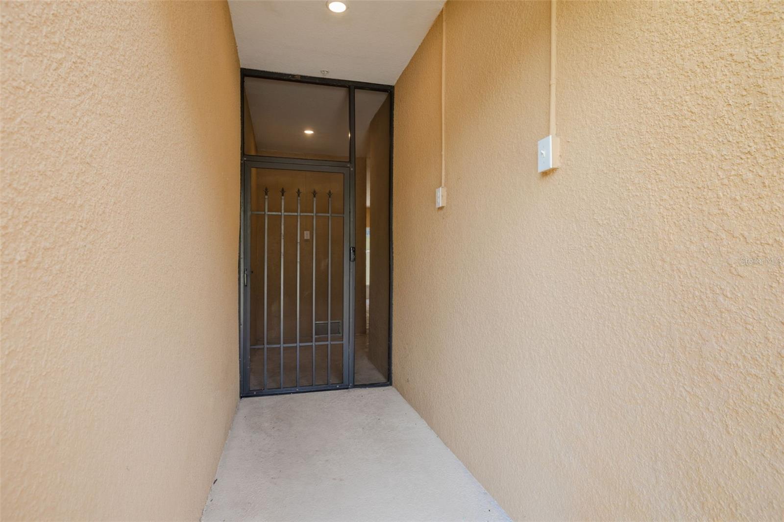 private entryway next to garage and guest parking