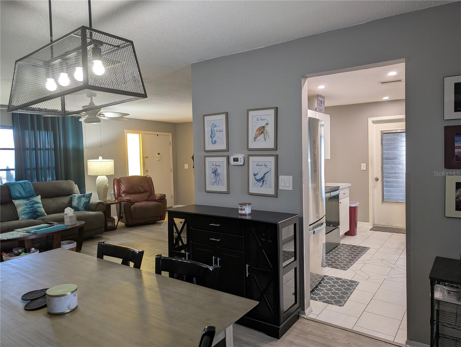 View kitchen and living area to entry.