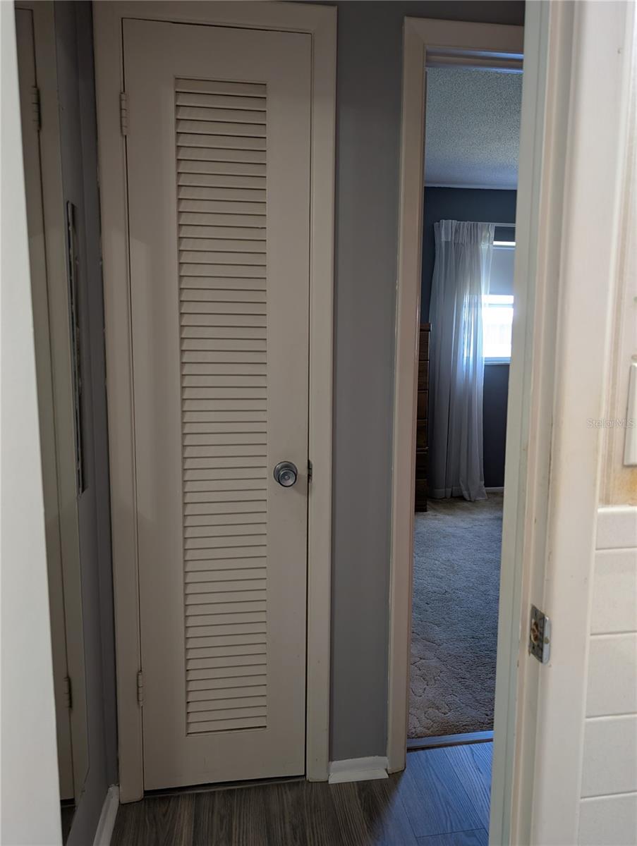 Linen closet from guest bath.  Guest bedroom to right.
