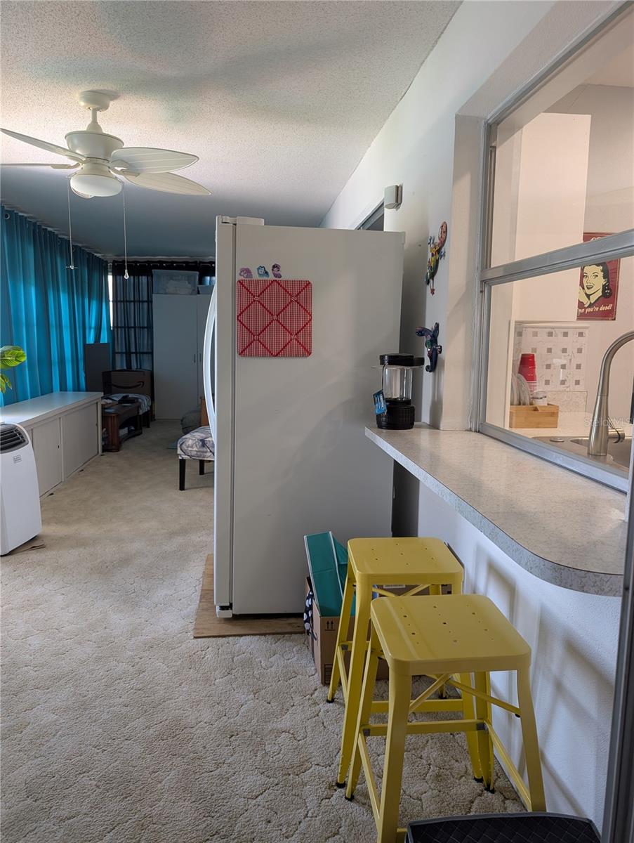 L shaped Florida room provides tons of potential for additional living space.  There is 400 square feet of additional living space offering access to the back patio, Bonus area, both bedrooms and the dining area....this is THE ROOM with a THE VIEW! There is also a breakfast bar with pass thru window into the kitchen.