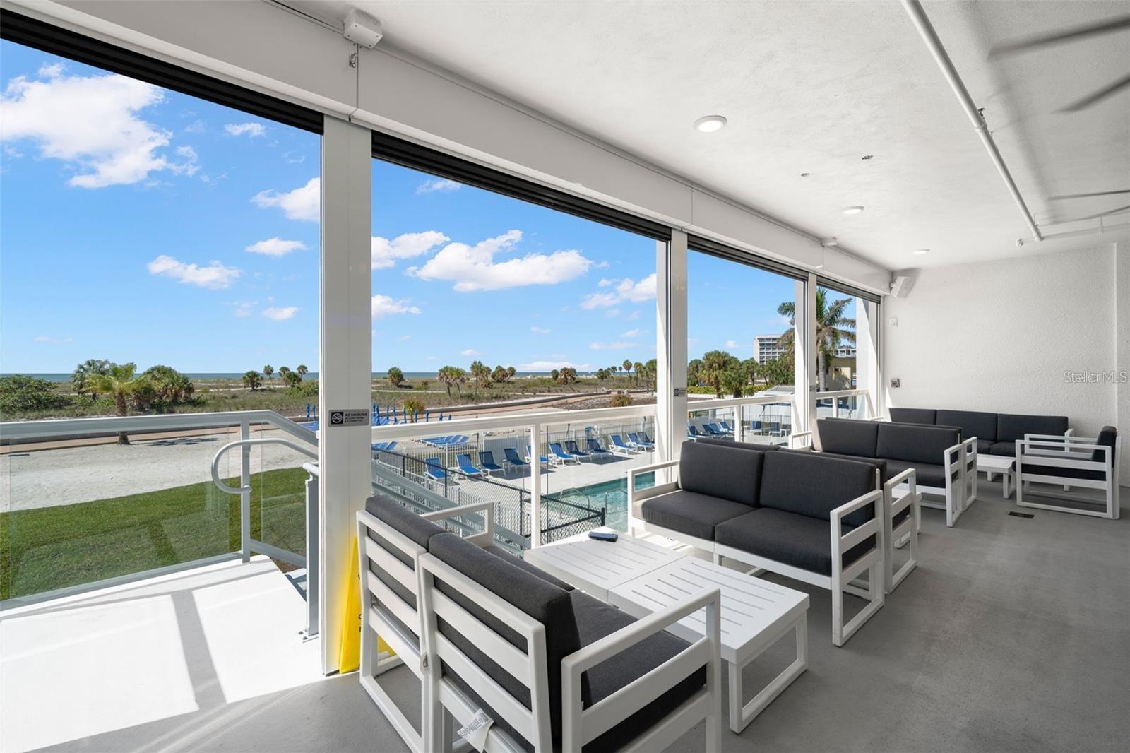 OCEAN CLUB LOUNGE WITH ACCESS TO THE POOLSIDE.