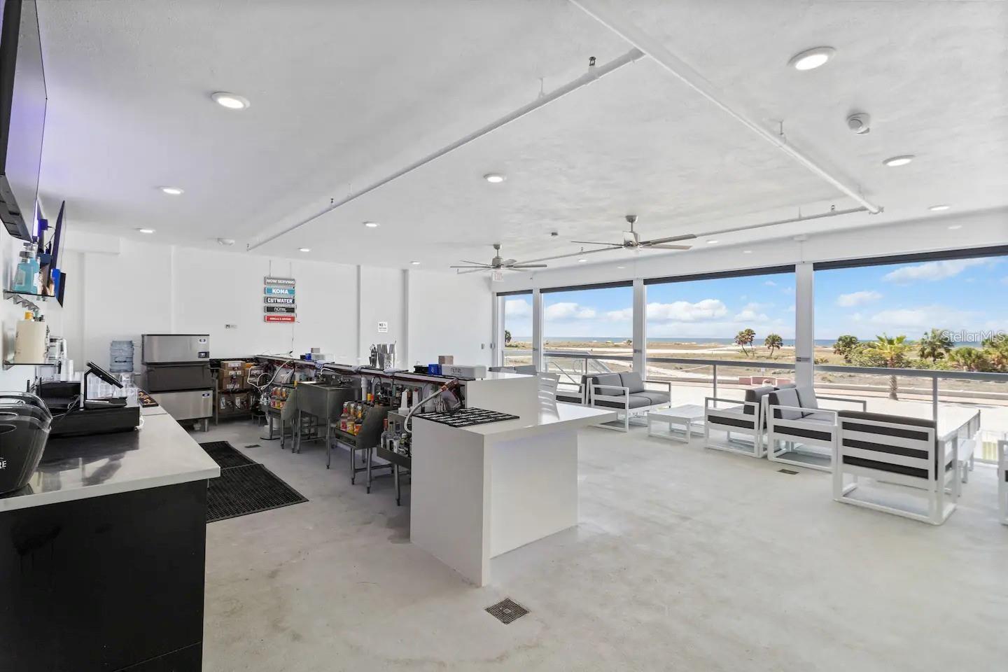 Bar lounge with access to the pool area. Electric sunshades when needed.