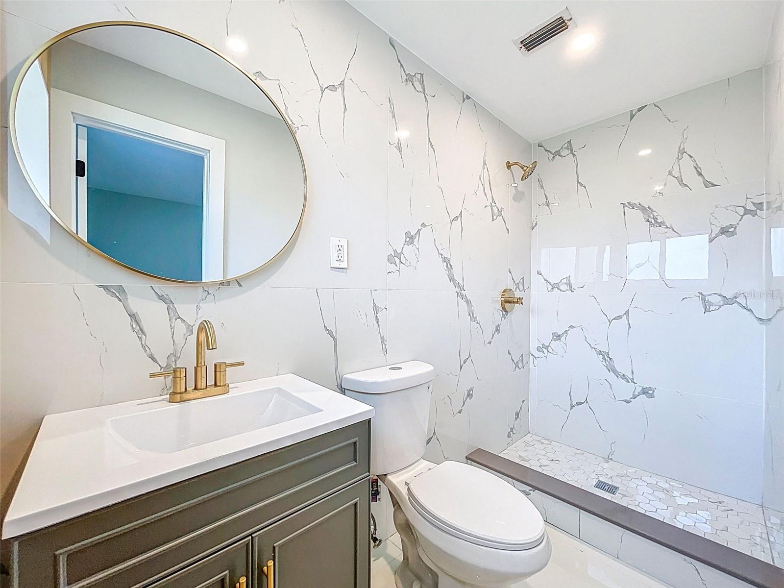 Fluted wood wall in owner bath suite