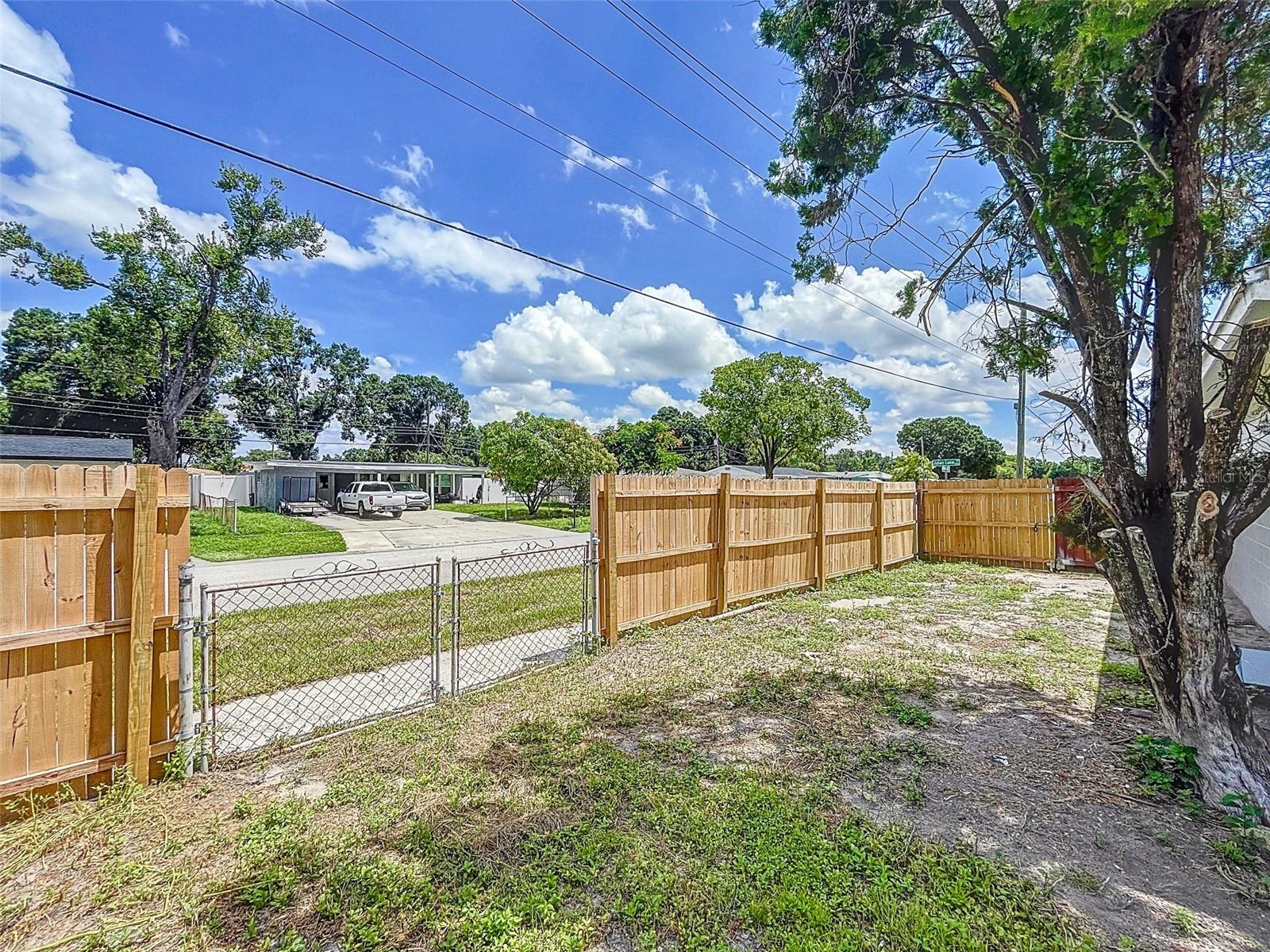 gate to bring your camper or boat into the large yard for storage