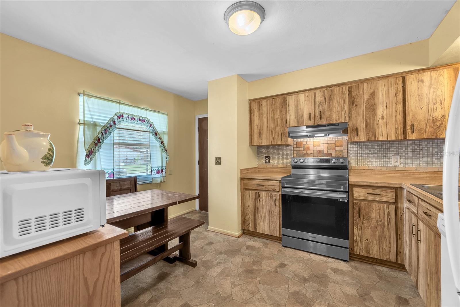 The eat-in kitchen is located at the front of the house.