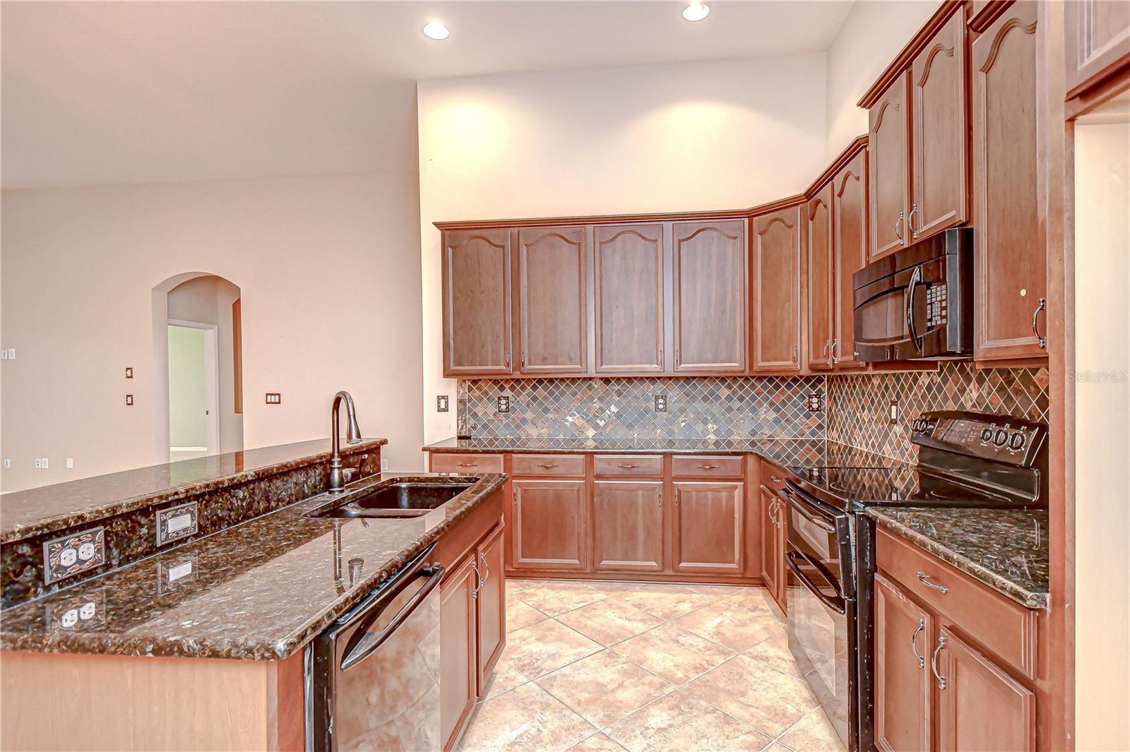 Granite countertops, black appliances including double oven!