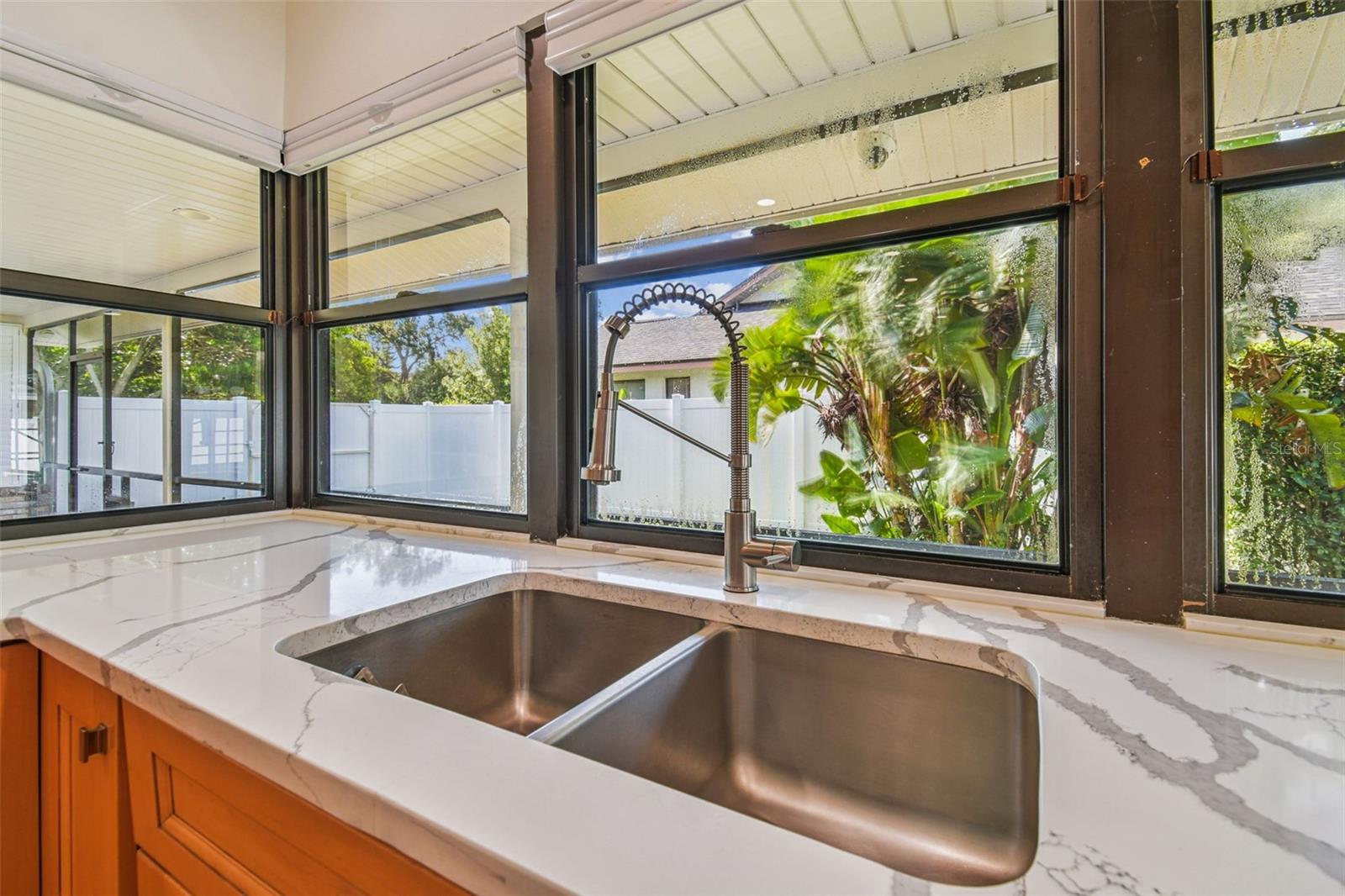 Kitchen Sink w/views of side yard and Server Window Access to Patio