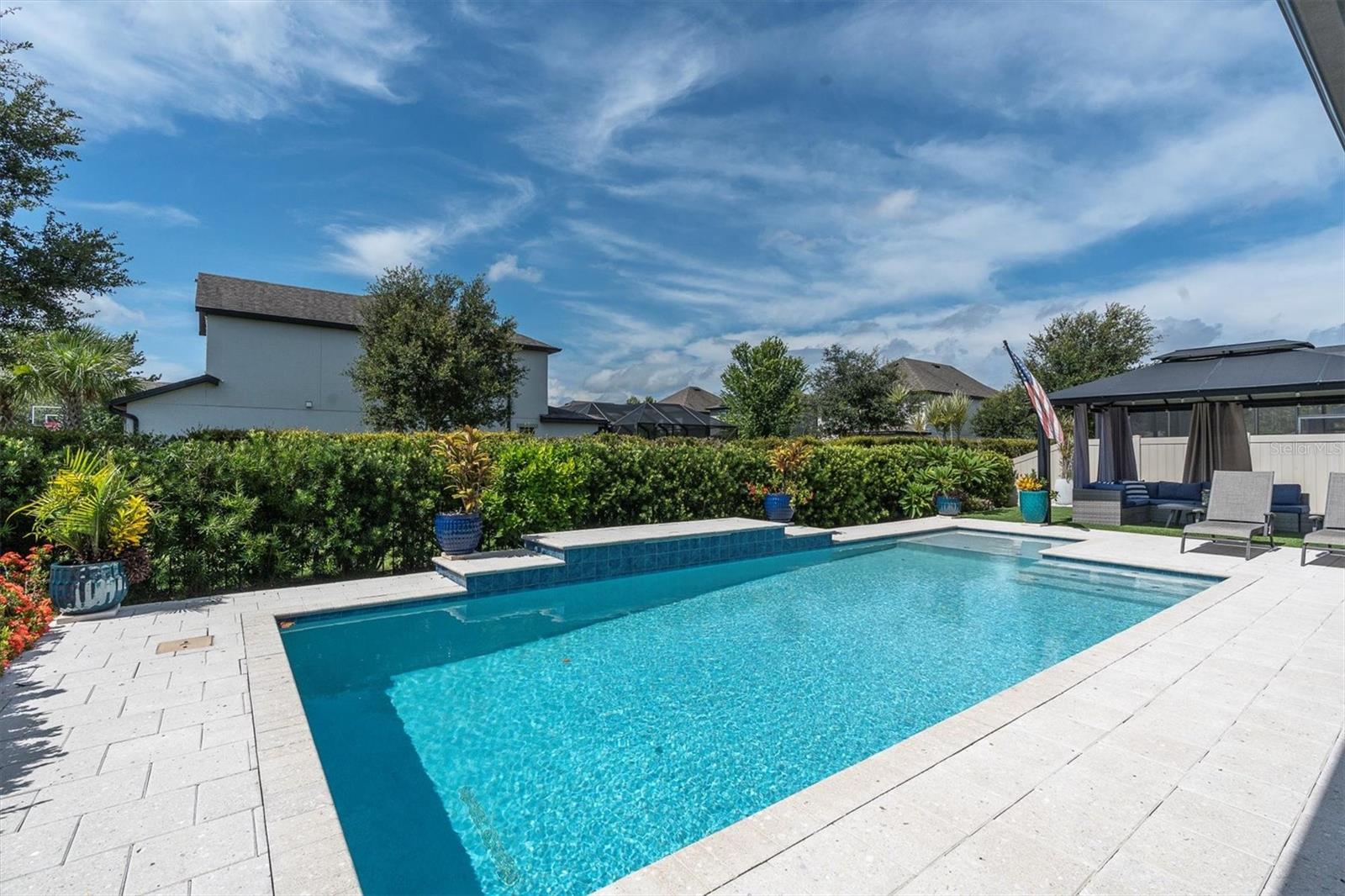 A PRIVATE OUTSIDE OASIS WITH LOW MAINTENANCE TURF YARD AND FULLY FENCED