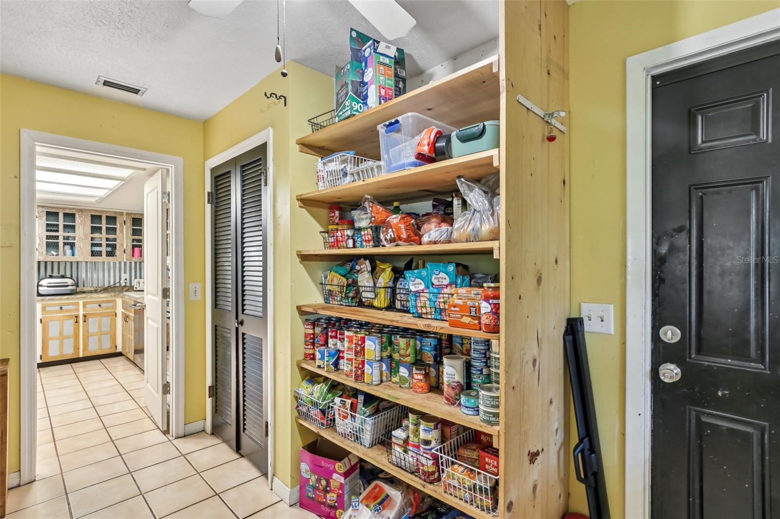 Pantry and Laundry Room with exit to Bonus Room