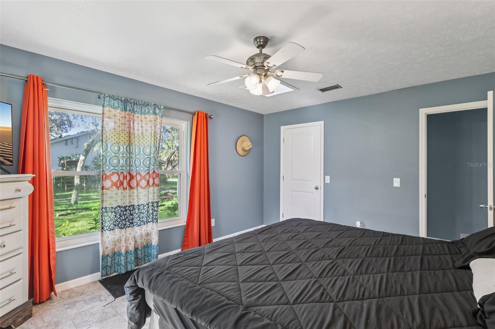 Primary bedroom with tons of natural light