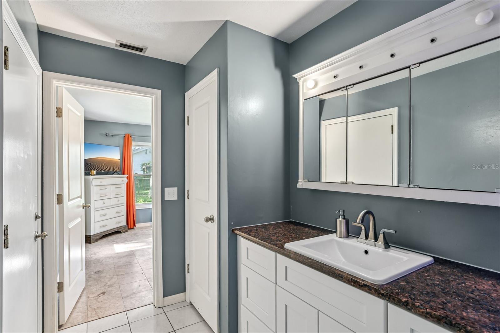 Primary Bathroom with granite counter