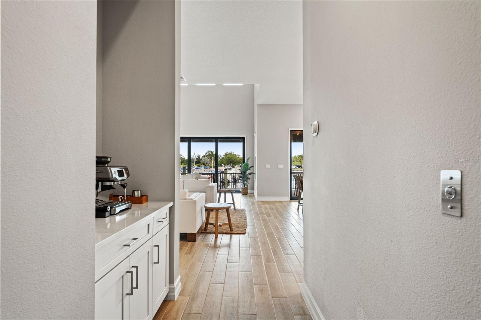 Hallway view of dry bar into living room