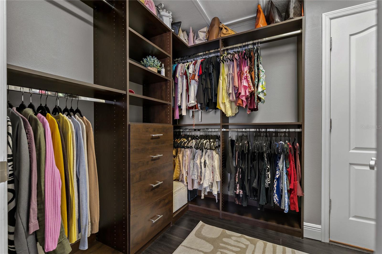 OVERSIZED WALK IN CLOSET WITH CLOSET ORGANIZATION SYSTEM