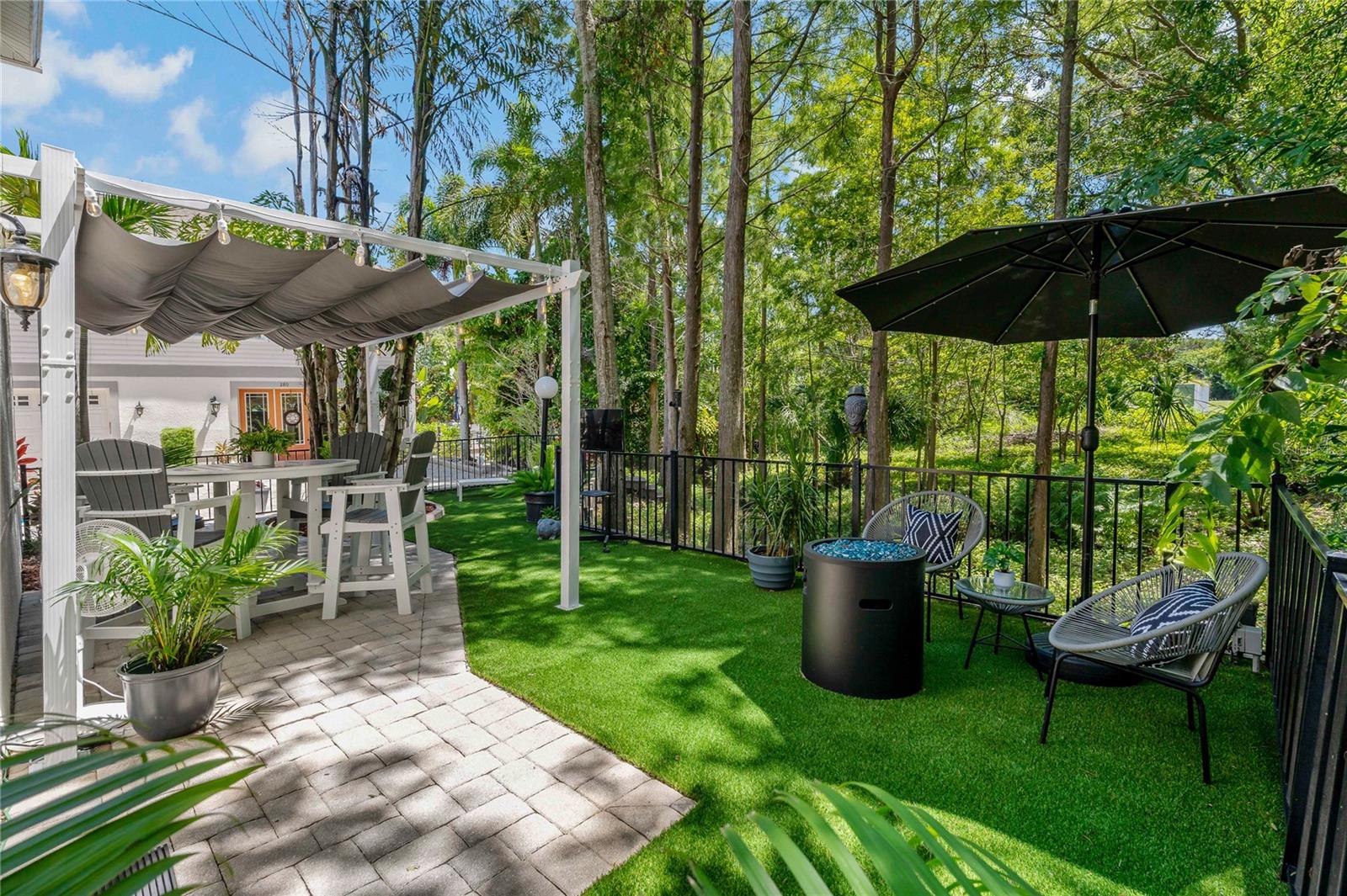 GREAT SPACE WITH PERGOLA, BRICK PAVERS AND ARTIFICIAL TURF ~ AND FULLY FENCED IN!