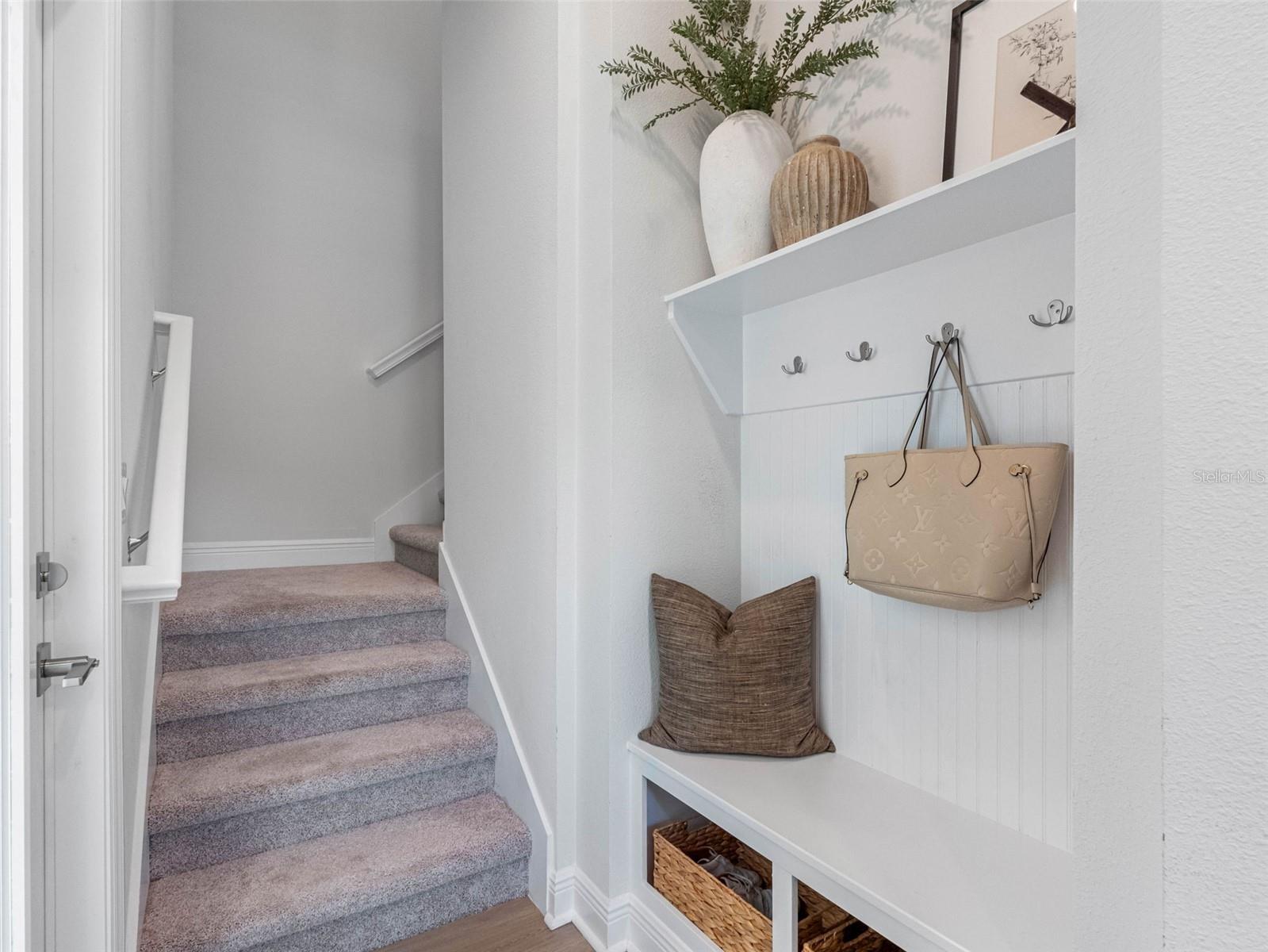 Mudroom with an exterior door that leads to the attached ADU
