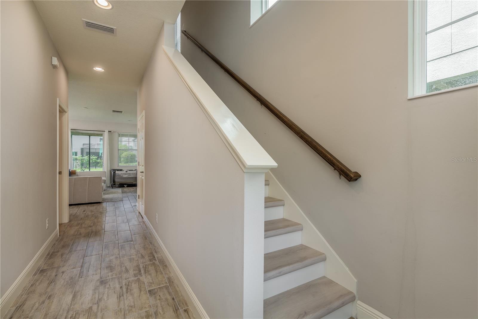 Upper level staircase with vinyl flooring