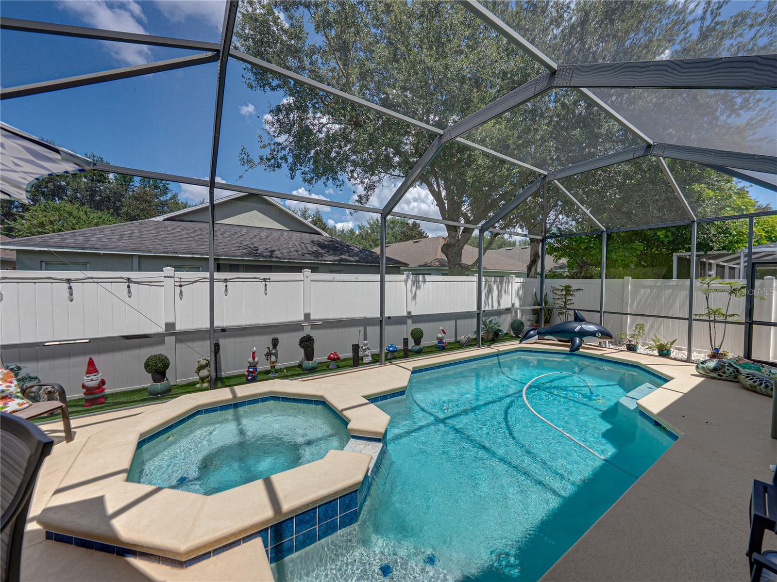 Screened-in pool with spa