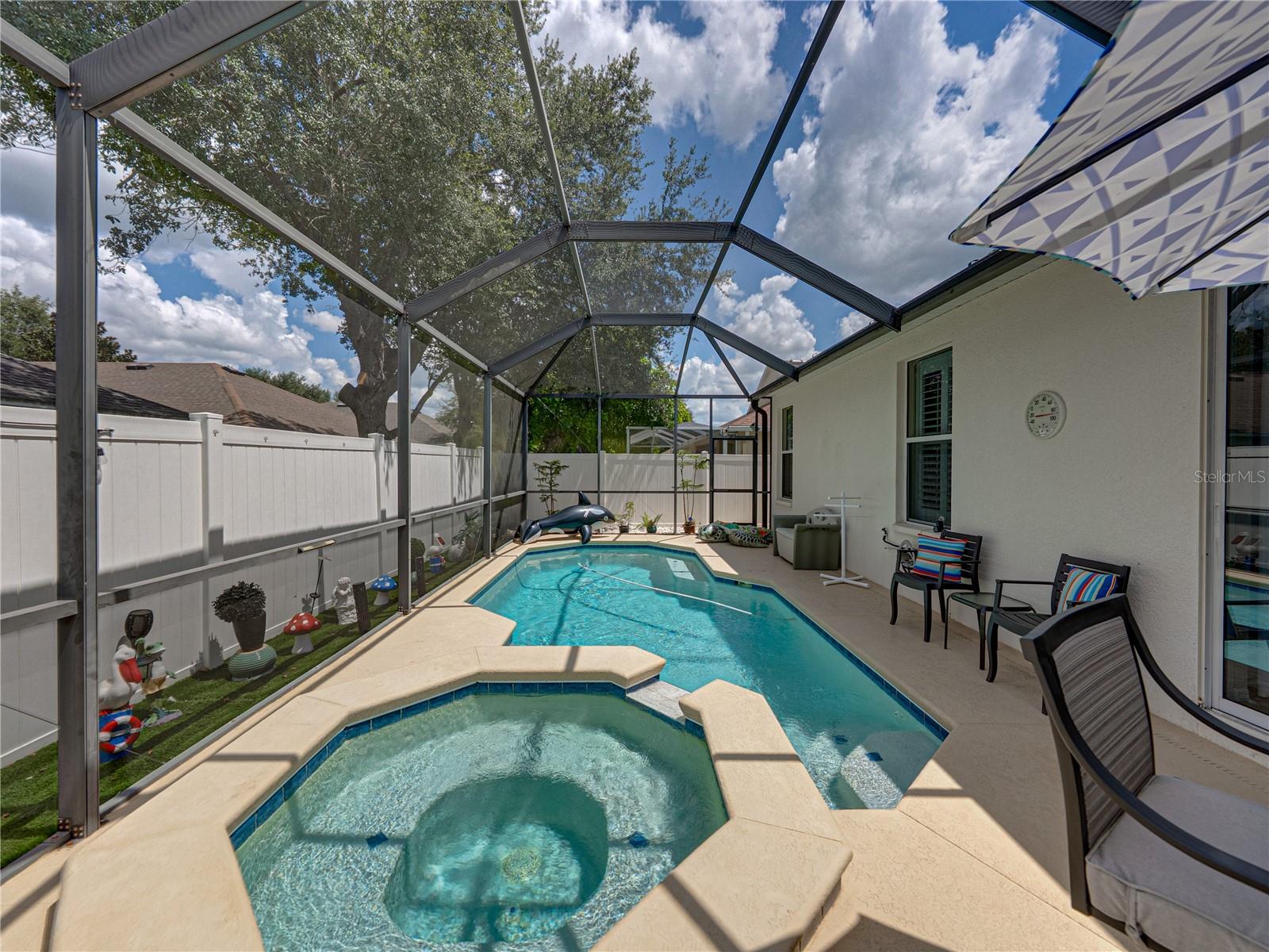 Screened-in pool with spa