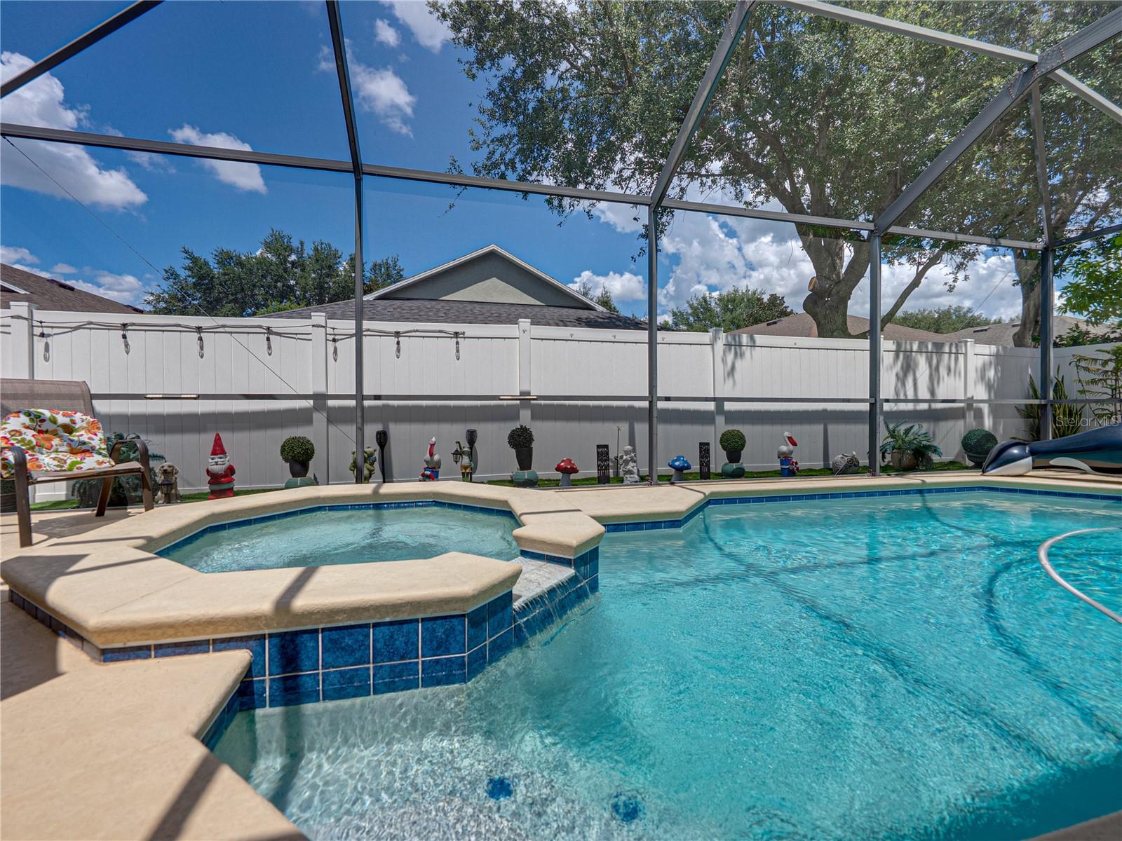 Screened-in pool with spa