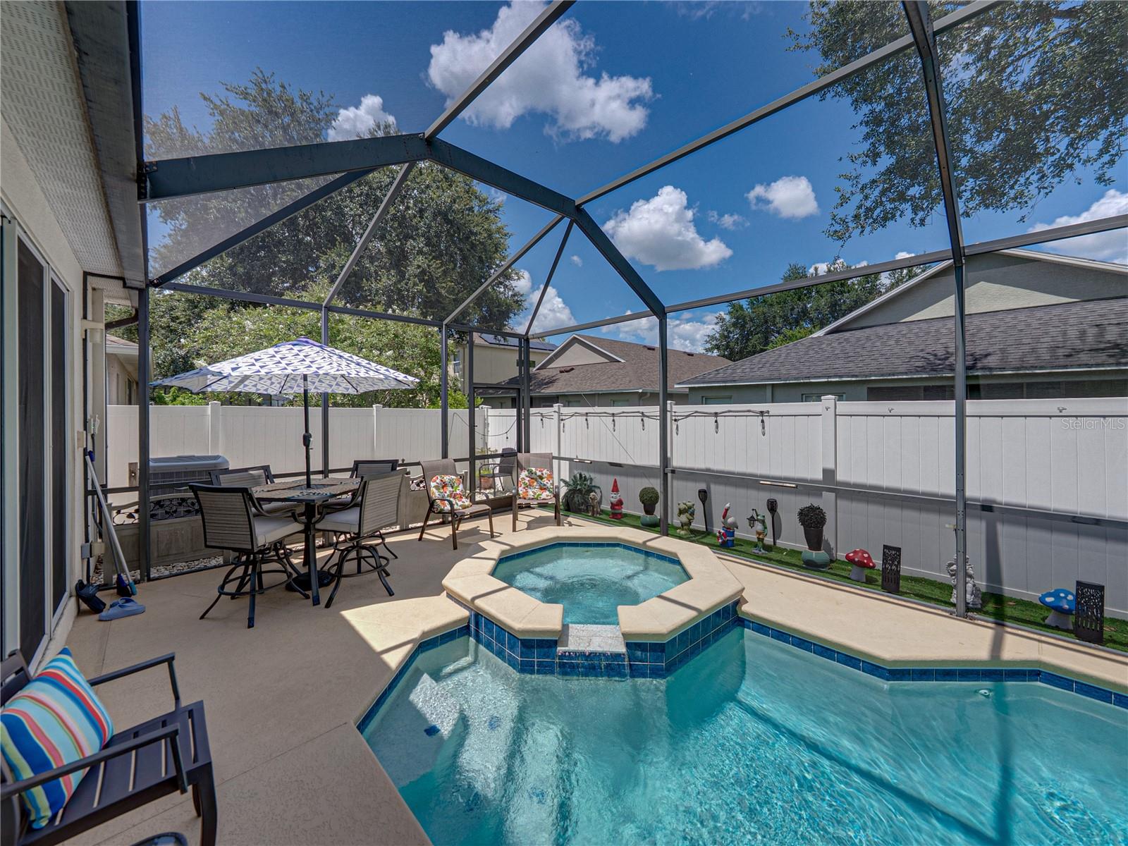 Screened-in pool with spa