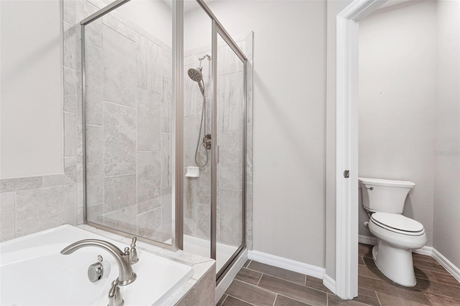 Primary ensuite with shower & soaking tub